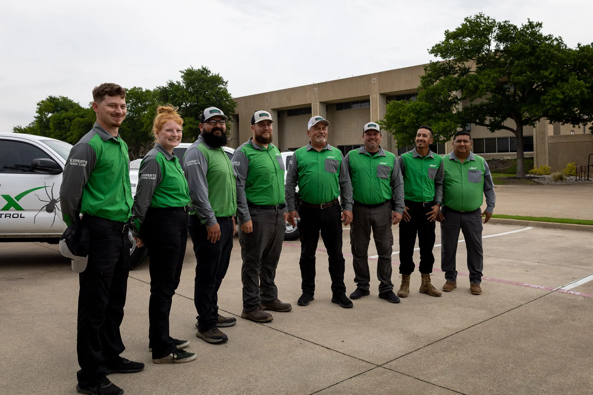 The Vinx Pest Control team standing together outdoors.